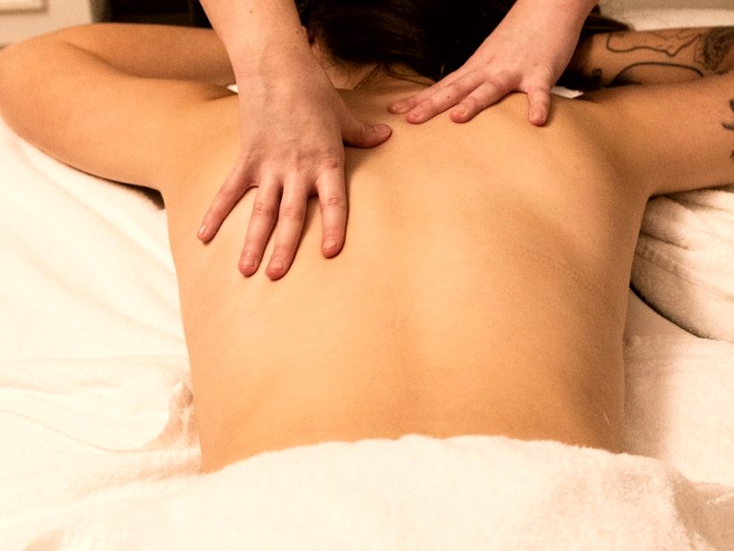 Classic full-body massage: hands on the upper back