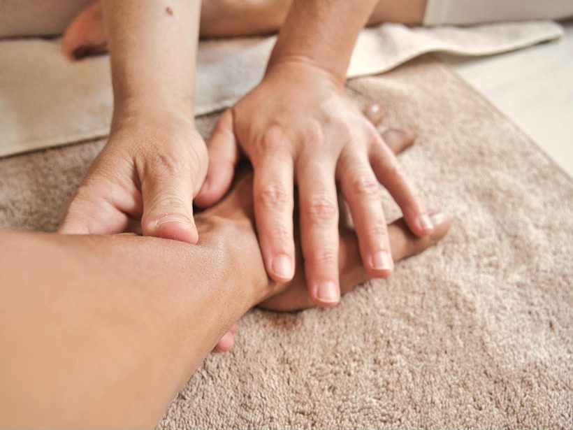 Lymphatic drainage massage: gentle strokes along the arm